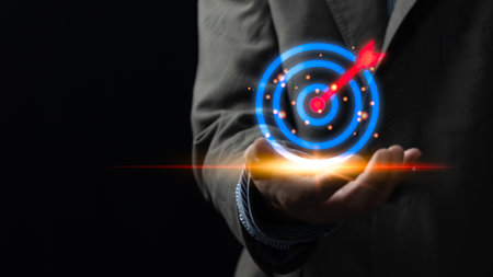 Businessman showing dart board and arrows with icons on hand virtual, business target planning development leadership investment marketing strategy concept.の写真素材