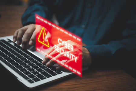 Businessman programmer, developer using laptop computer with triangle caution warning sign. system hacked on computer network cybersecurity vulnerability.の写真素材