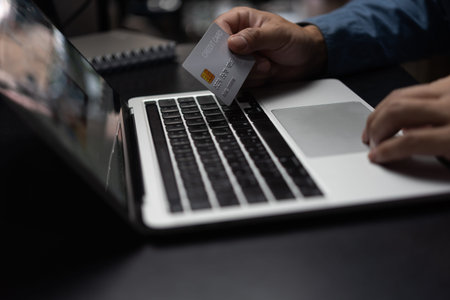 businessman using credit card and laptop to login to internet bank.Online shopping, e-commerce,...