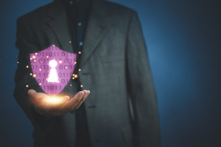 Businessman holding shield protect icon. Cyber security network. Padlock icon and internet technology networking security system. Business data personal information on virtual interface.の写真素材