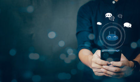 businessman using smart phone chatting with a smart AI or artificial intelligence. Digital technology robot information concept.の写真素材