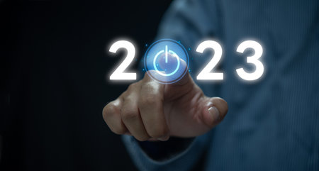 Businessperson touching icon power on 2023 virtual screen.ides success and target and plan concept.の写真素材