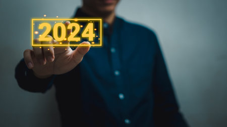 Hand man touching button 2024 new year.