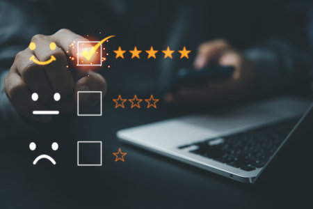 Five Star Customer Service Concept for Satisfaction.Businessman holding mobile smartphone for quality feedback related projects, marketing materials, and brandingの写真素材