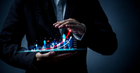 Stock Market Success Upward Graphs and Charts with Arrows. Businessman holding smartphone graph and chart growth, marketing and planing and strategy concept.の写真素材