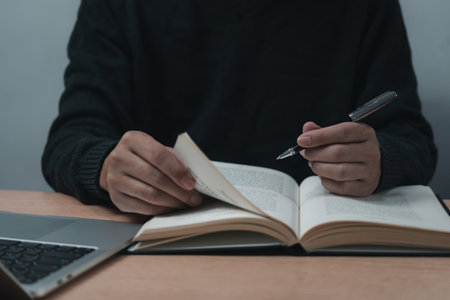 Hands Writing with Pen on Notebook. concept of work, study, and education.の写真素材