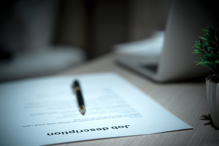 Job Description document with Pen on the table.の写真素材