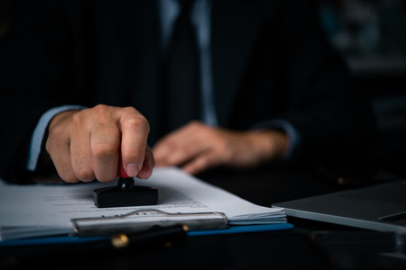 Authorized person rubber stamps contract certificates and office agreement documents.の写真素材