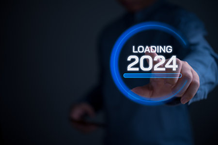 Hand touching loading 2024. Business startup strategy growth and target success data investment finance concept.の写真素材