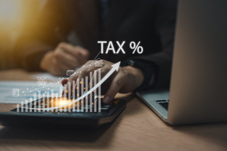 Tax planning and collection strategies are crucial for government business. Businessman uses a calculator VAT, tax deduction, and credit. Strategy investment growth finance business conceptの写真素材