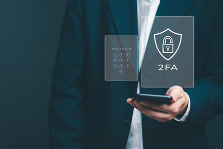 Enhancing cybersecurity with 2FA Two-Factor Authentication, Login Security, User ID Protection, and Encryption to thwart cyber hackers. Businessman holding mobile internet online network.の写真素材