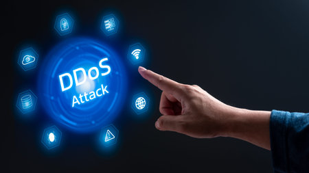 A hand pointing to a blue circle with the word ddos attack in white. The circle is surrounded by...