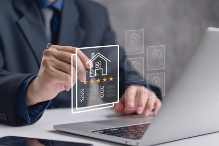 Hand with a digital interface real estate reviews and ratings. Highlights property evaluation and customer satisfaction. Useful for real estate, customer service, and online review platforms.の写真素材