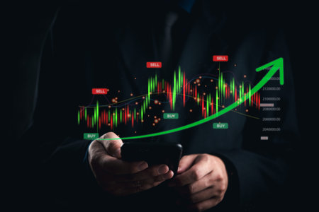 businessman analyzes stock market trends on a smartphone, observing buy and sell indicators with a...