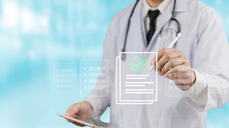 A health care professional working medical checklist to verify patient records. technology in hospitals and clinics for health evaluations. Checklist surveys, check boxes, and medicine managementの写真素材