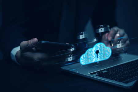 Cybersecurity concept with a businessman using a smartphone and cloud security icons, representing data protection and encryption.の写真素材