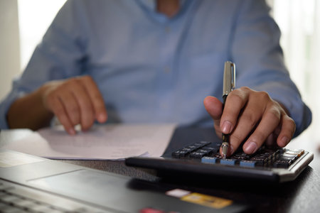 Close-up of accountant calculating tax and budget data. Financial planning, report analysis, money...