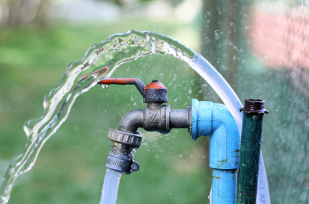 Close up faucet old With Water Splash, Focus faucetの写真素材