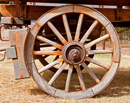 Wheel of a wooden wagon with brakeの写真素材