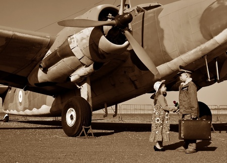 Pilot gives wife a red rose before flying off to warの写真素材