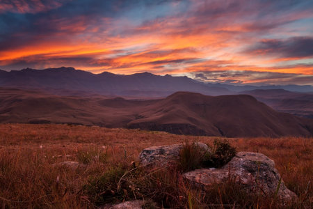Sunset over Drakensberg mountains with orange, pink and blueの写真素材