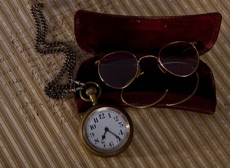 Pocket watch and glasses old detail macro vintageの写真素材