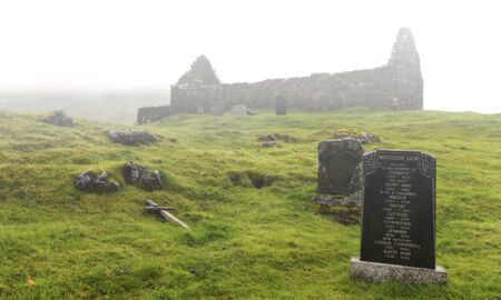 The ruins and graveyard of Cill chriosd on Isle of Skye in mistの写真素材