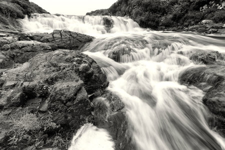 Waterfall at the Hermitage bridge on a rainy dayの写真素材
