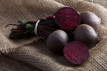 Bunch of beetroot on a brown burlap cloth with close-upの写真素材