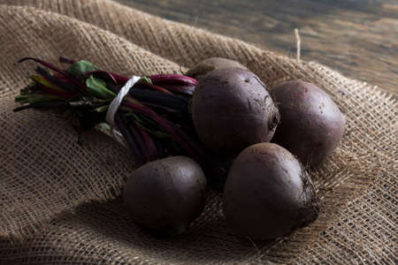 Bunch of beetroot on a brown burlap cloth with close-upの写真素材