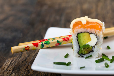 Delicious mixed sushi arranged on a white marble surfaceの写真素材