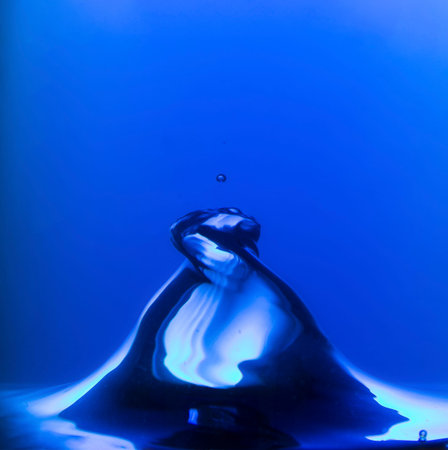Blue water spiral of water swirling around in a studio