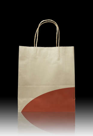 Brown paper bag on reflect floor and dark backgroundの写真素材