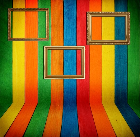 Gold frame on colorful wood Backgroundの写真素材