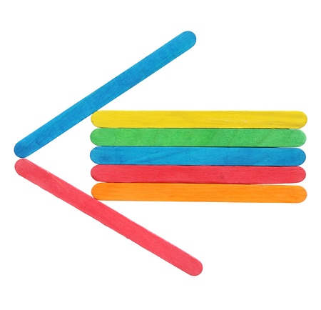 Colorful wooden arrows sign isolated on whiteの写真素材