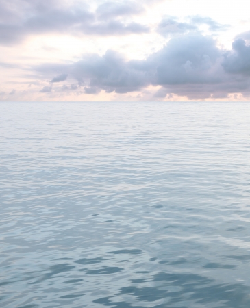 sea with waves and cloudy skyの写真素材
