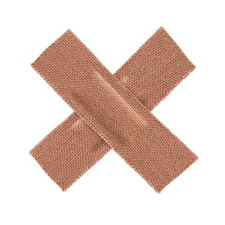 First aid plaster isolated on white backgroundの写真素材