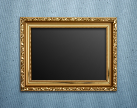 Empty golden vintage frame on wallpaper backgroundの写真素材