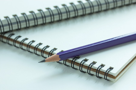 Close up pencil and spiral notebook, Selective focus pointの写真素材