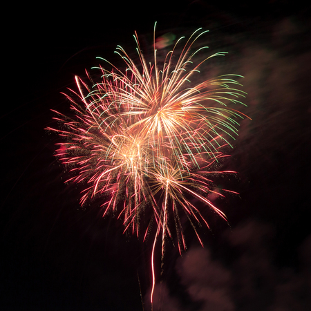 fireworks in the dark sky backgroundの写真素材