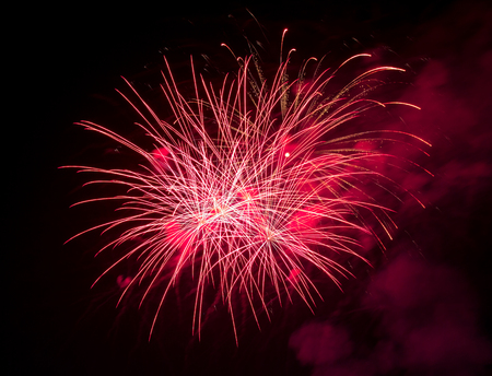 fireworks in the dark sky backgroundの写真素材