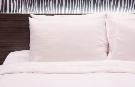 white pillow on the bedの写真素材