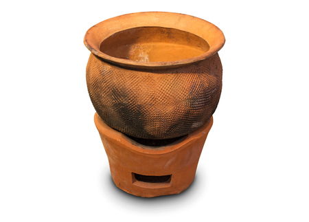 Clay pot on clay stove isolated on white backgroundの写真素材