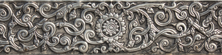 Pattern of silver metal plate with flower carved background, Thai style in templeの写真素材