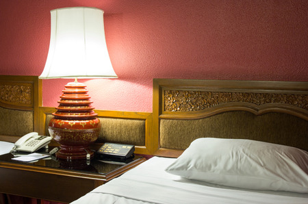 Table lamp in the bedroom at night timeの写真素材