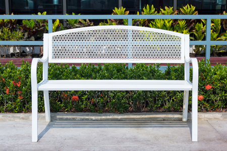 empty long white metal chair in the park outdoorの写真素材