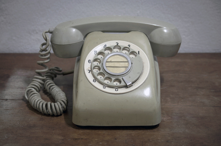 old phone on wooden tableの写真素材
