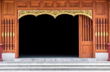 carved wooden door in thai temple. decoration of wood patternの写真素材