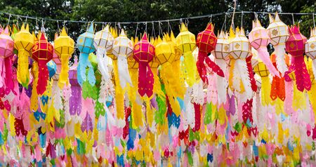 colorful hanging lanterns lighting in loy krathong festival at northern of thailandの写真素材