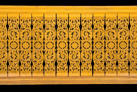 Pattern of flower carved on wood wall background. Traditional Thai style patternの写真素材
